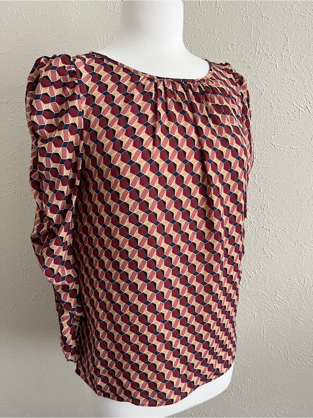 Max Studio geometric blouse featuring puff sleeves